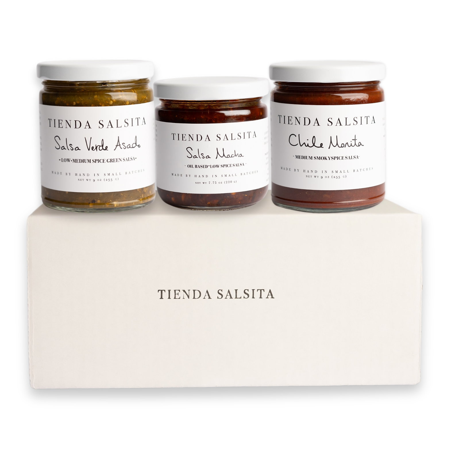 Three jars of Tienda Salsita salsa on a white block with 'Tienda Salsita' branding.