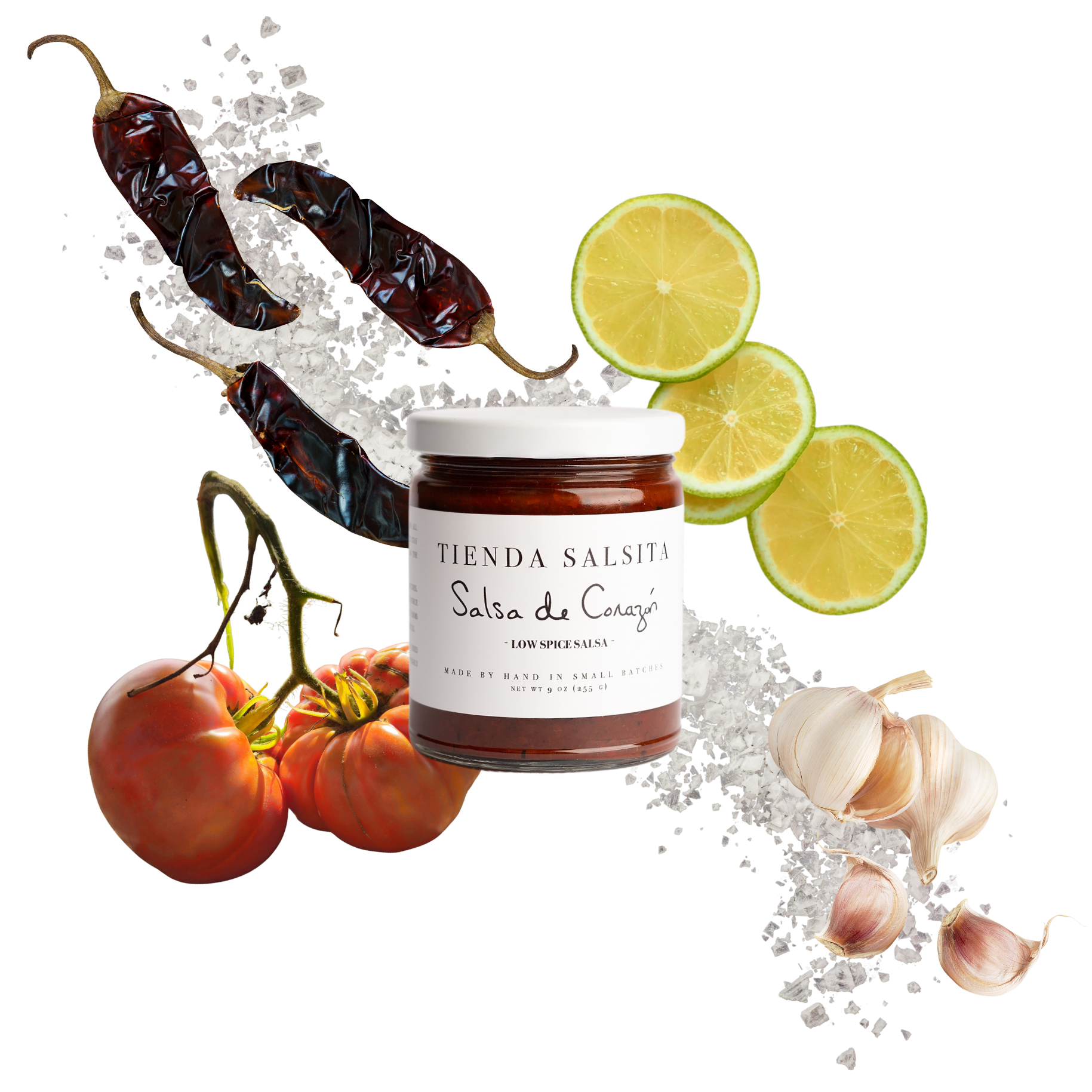 Jar of 'Tienda Salsita' salsa surrounded by chili peppers, tomatoes, and limes on a white background