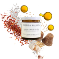 Jar of Tienda Salsita Salsa Chile Tusta with ingredients like chile flakes and oil on a white background