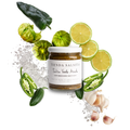 Jar of Tienda Salsita salsa verde with green peppers, limes, and garlic on a white background